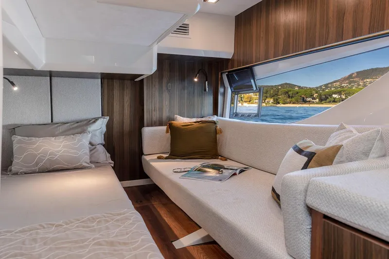 Slide: The Image of Manufacturer Provided Image: Interior of Marex 440 Gourmet Cruiser 2026 with sofa and window view. - 10
