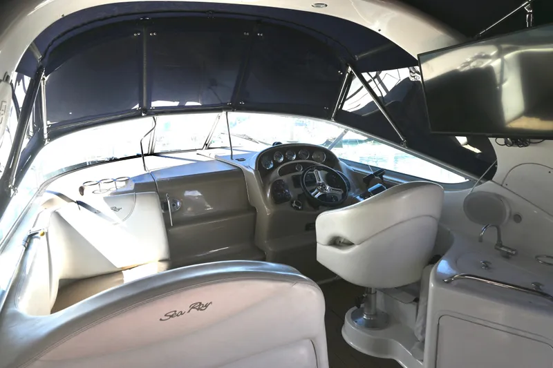 Slide: The Image of Interior of 2005 Sea Ray Sundancer 280 boat with steering wheel and seating. - 11
