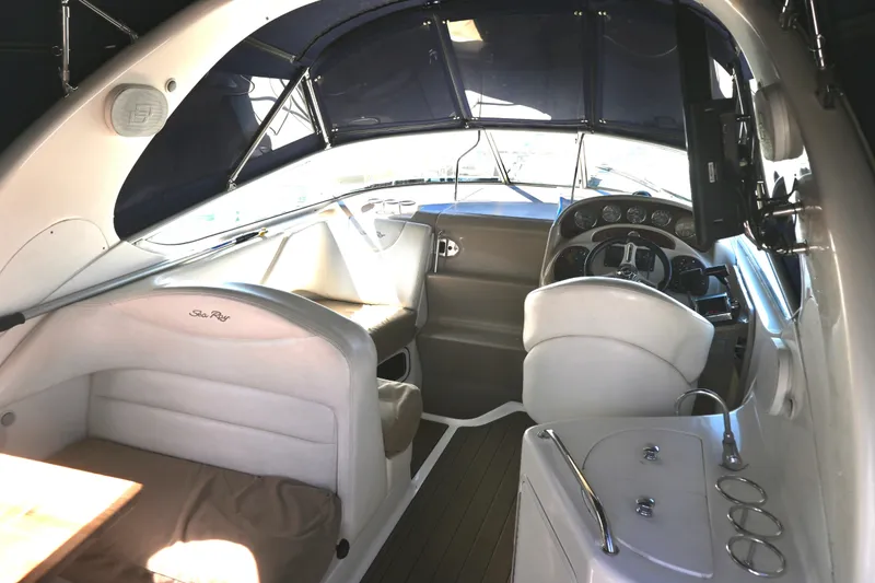 Slide: The Image of Interior of 2005 Sea Ray Sundancer 280 boat, featuring helm and seating area. - 12