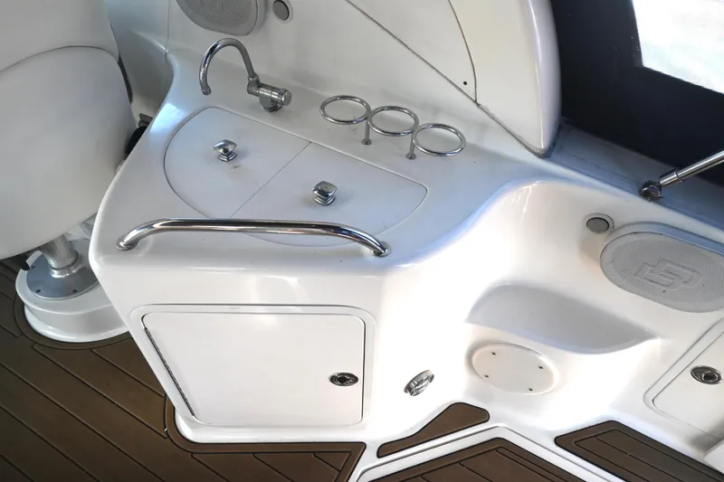 Slide: The Image of 2005 Sea Ray Sundancer 280 boat interior with sink and storage area. - 13