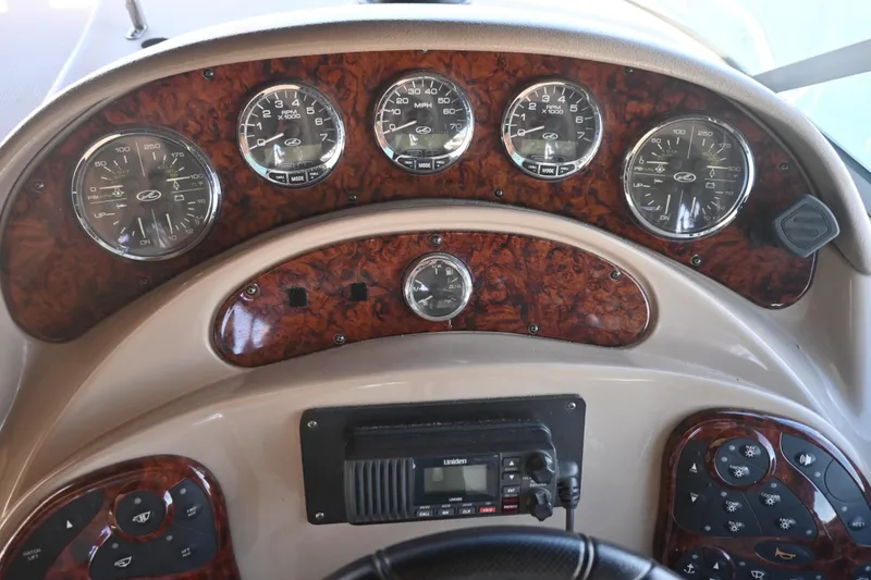 Slide: The Image of Dashboard of 2005 Sea Ray Sundancer 280 boat with gauges and controls. - 18