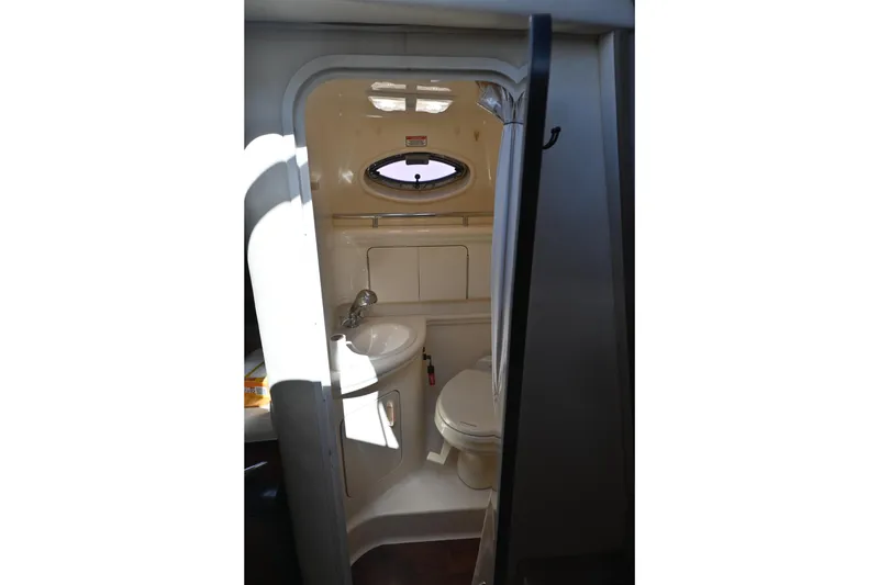 Slide: The Image of 2005 Sea Ray Sundancer 280 bathroom interior with sink and toilet. - 23