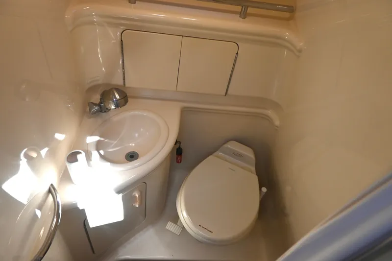 Slide: The Image of 2005 Sea Ray Sundancer 280 bathroom with sink and toilet. - 24