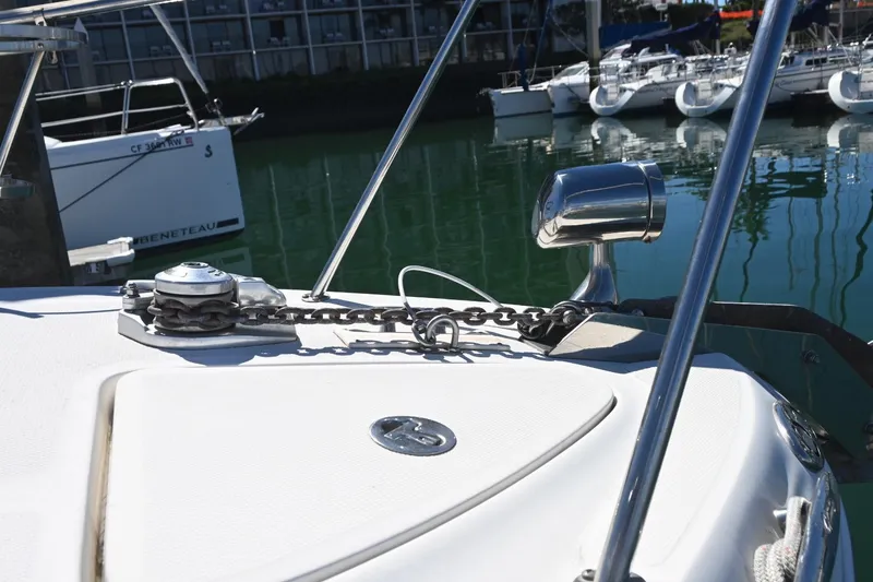 Slide: The Image of 2005 Sea Ray Sundancer 280 boat deck with anchor chain and marina view. - 35