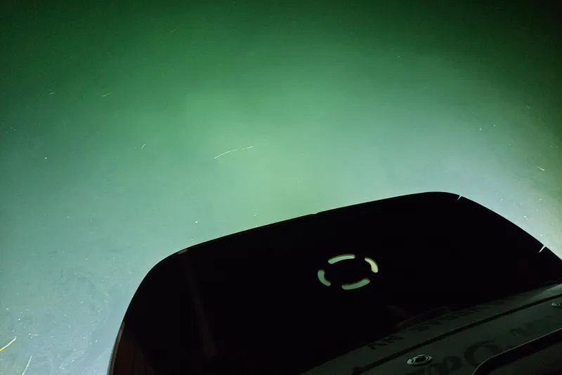 Slide: The Image of 2005 Sea Ray Sundancer 280 boat with underwater lights illuminating the water. - 38