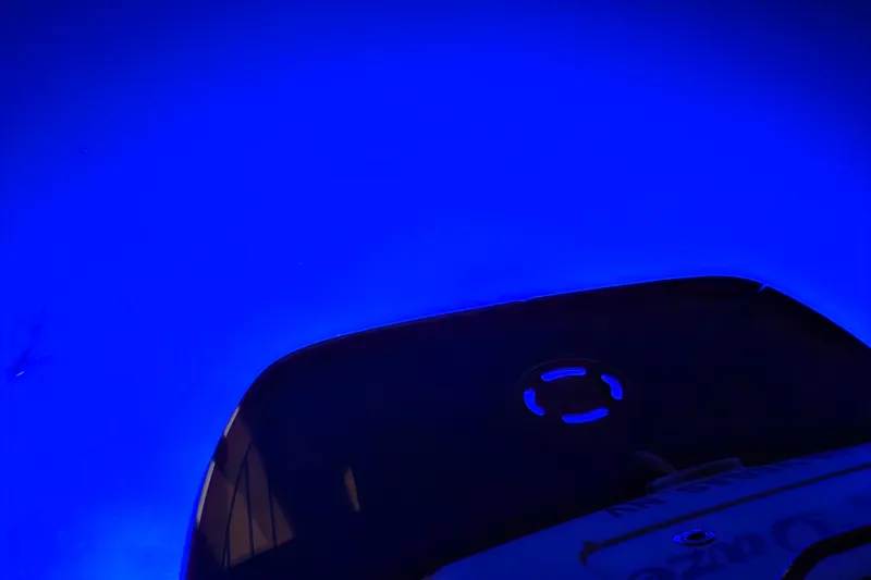 Slide: The Image of 2005 Sea Ray Sundancer 280 boat with vibrant blue underwater lighting. - 39