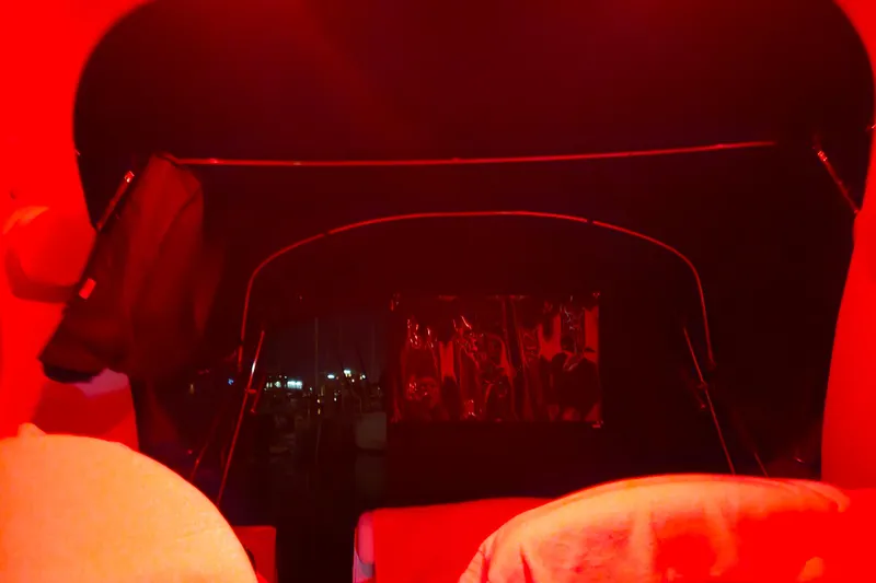 Slide: The Image of Interior of a 2005 Sea Ray Sundancer 280 boat illuminated by red lighting. - 42