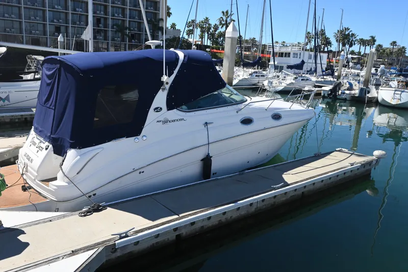 Slide: The Image of 2005 Sea Ray Sundancer 280 docked at marina with blue canopy. - 5
