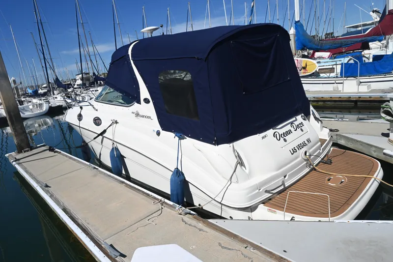 Slide: The Image of 2005 Sea Ray Sundancer 280 docked at marina with blue canopy. - 9