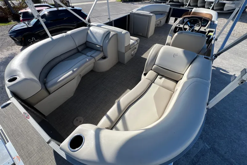Slide: The Image of 2023 Cypress Cay Seabreeze 232 pontoon boat interior with plush seating and modern design. - 13