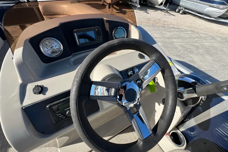 Slide: The Image of Steering console of 2023 Cypress Cay Seabreeze 232 pontoon boat with modern controls. - 14