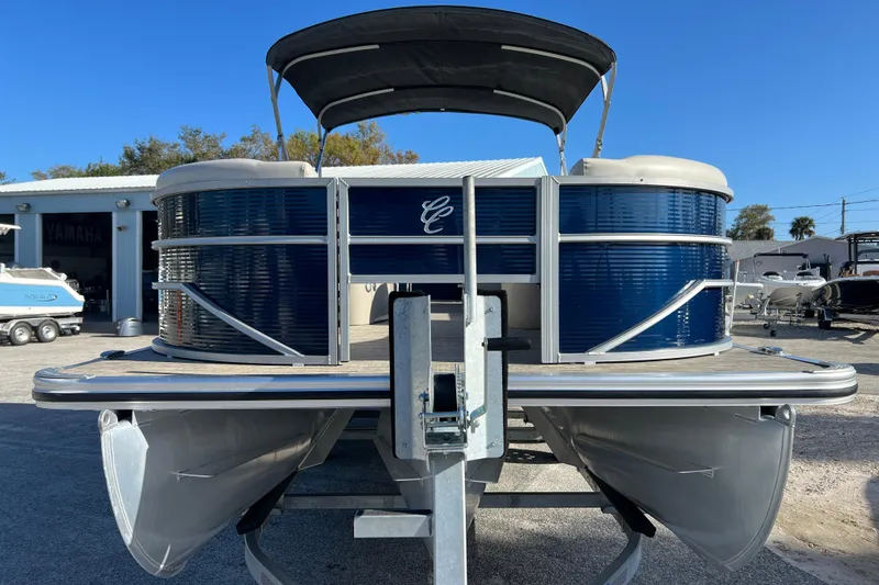 Slide: The Image of 2023 Cypress Cay Seabreeze 232 pontoon boat on trailer, blue exterior, sunny day. - 3