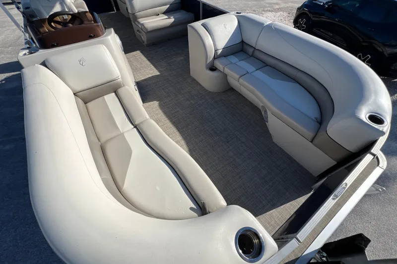 Slide: The Image of 2023 Cypress Cay Seabreeze 232 pontoon boat interior with plush seating and cup holders. - 9