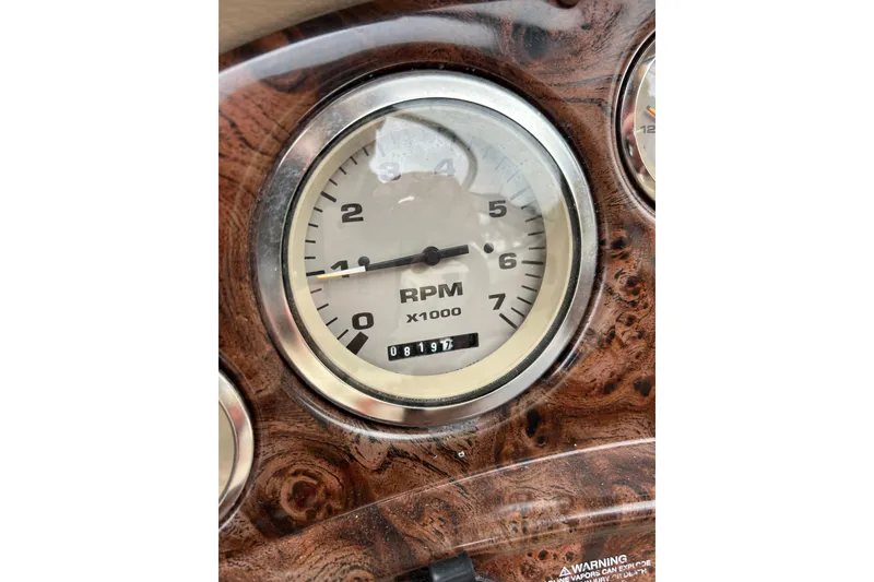 Slide: The Image of 2001 Stingray 200 LS/LX RPM gauge on woodgrain dashboard, showing 0.8 hours. - 11
