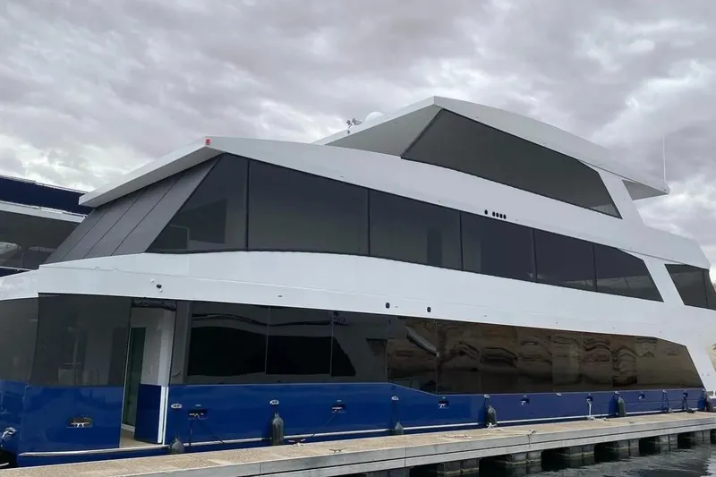 The Image of Modern Adonia yacht docked, model Ataraxia Trip #2, June 2023, under cloudy skies. - 1