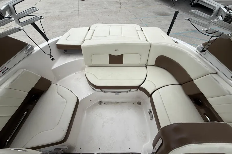 Slide: The Image of Interior seating of 2018 Chaparral 227 SSX Surf boat, featuring white and brown upholstery. - 12