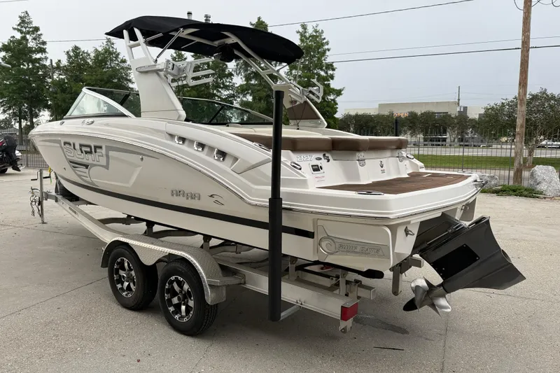 Slide: The Image of 2018 Chaparral 227 SSX Surf boat on trailer, featuring sleek design and modern features. - 4