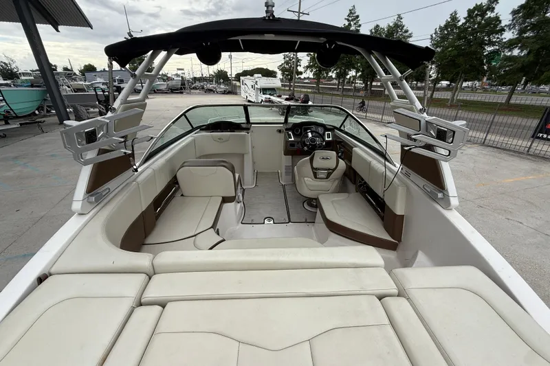 Slide: The Image of 2018 Chaparral 227 SSX Surf boat interior with seating and steering console. - 7