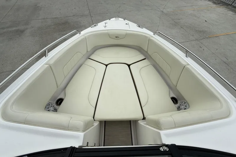 Slide: The Image of 2018 Chaparral 227 SSX Surf boat with spacious white seating area. - 8