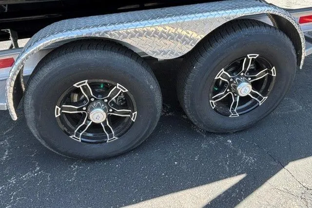 Slide: The Image of Trailer wheels with stylish black rims for 2023 Chaparral 267 SSX boat. - 27