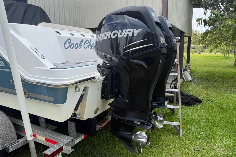 Slide: The Image of 2016 Boston Whaler 250 Outrage with twin Mercury engines on a trailer. - 13