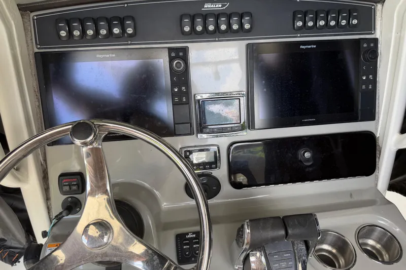 Slide: The Image of Control panel of a 2016 Boston Whaler 250 Outrage with dual Raymarine displays. - 18