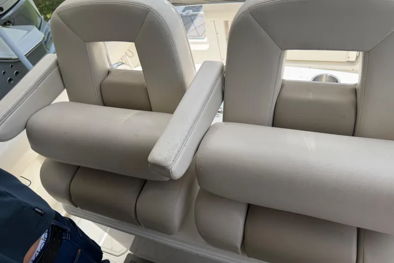 Slide: The Image of 2016 Boston Whaler 250 Outrage boat seats, featuring plush beige upholstery. - 26