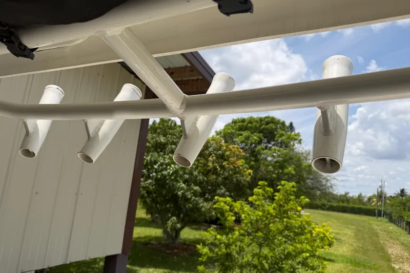 Slide: The Image of Rod holders on a 2016 Boston Whaler 250 Outrage, with a scenic outdoor backdrop. - 27