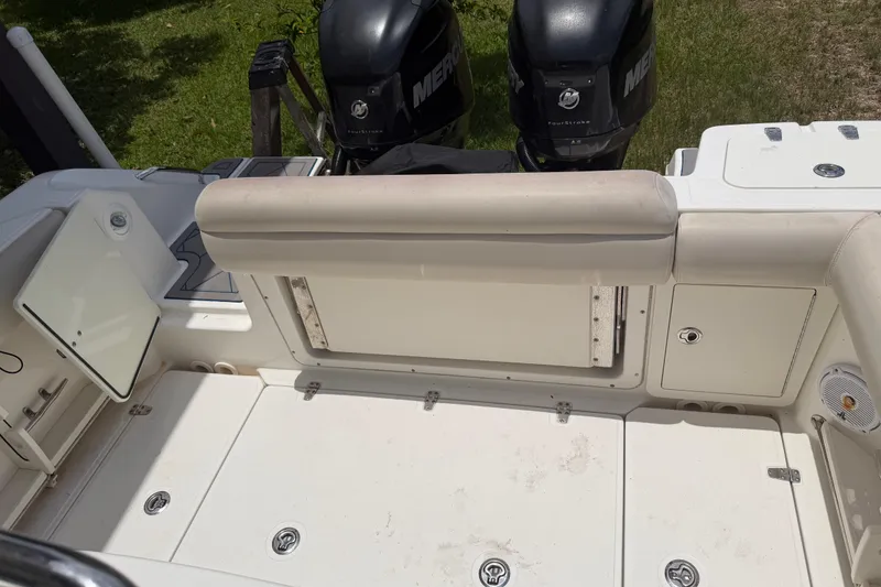 Slide: The Image of 2016 Boston Whaler 250 Outrage boat interior with dual Mercury outboard engines. - 28
