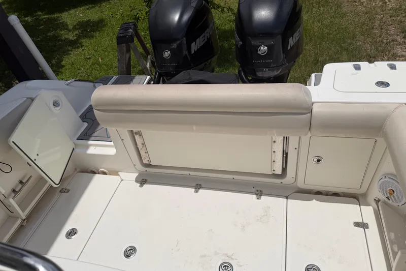 Slide: The Image of 2016 Boston Whaler 250 Outrage boat interior with dual Mercury engines. - 29