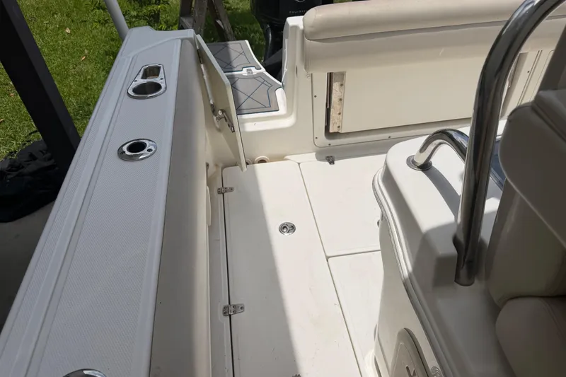Slide: The Image of Interior view of a 2016 Boston Whaler 250 Outrage boat, showcasing seating and deck features. - 31