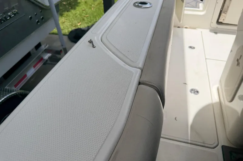 Slide: The Image of Interior view of a 2016 Boston Whaler 250 Outrage boat, showcasing seating and deck details. - 37
