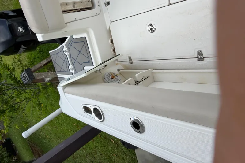 Slide: The Image of 2016 Boston Whaler 250 Outrage boat interior with storage compartments and seating. - 46