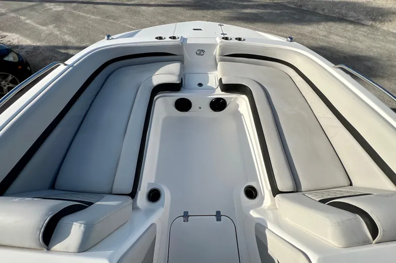 Slide: The Image of 2024 Hurricane Sundeck Sport 218 OB boat interior with cushioned seating and cup holders. - 14