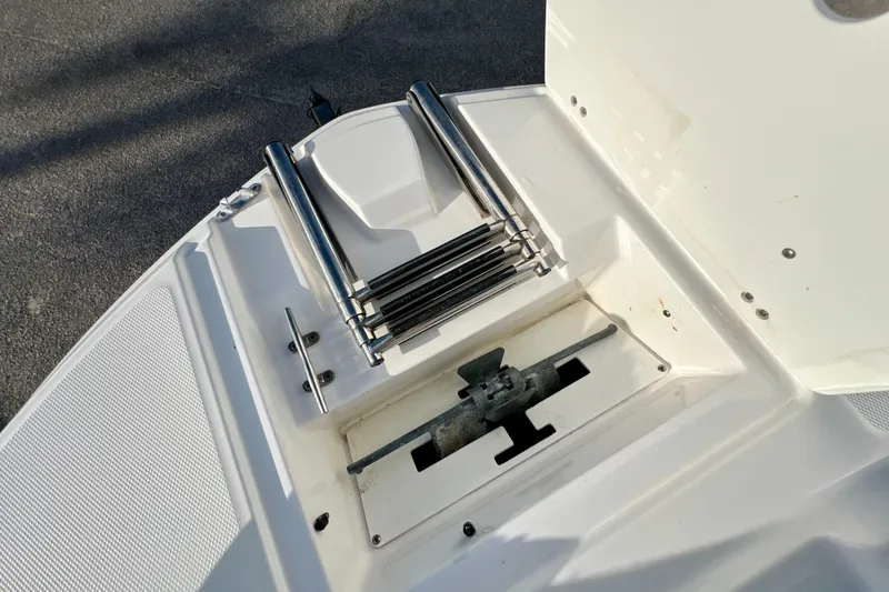 Slide: The Image of 2024 Hurricane Sundeck Sport 218 OB boat ladder and anchor storage area. - 15