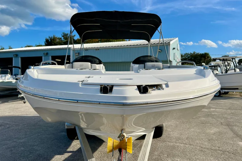 Slide: The Image of 2024 Hurricane Sundeck Sport 218 OB boat on trailer, sunny day, blue sky background. - 3