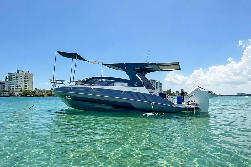 The Image of Luxury Hanover 305 boat on clear water, 2027 model, with cityscape background. - 0