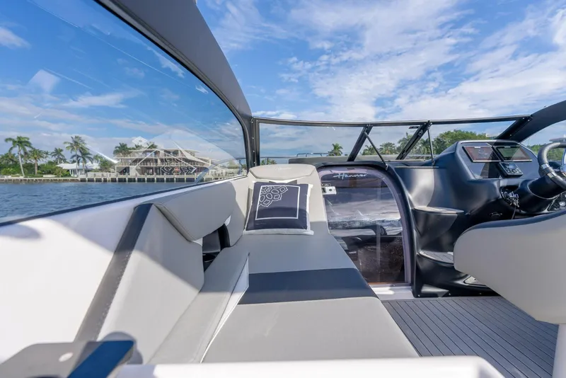 Slide: The Image of Luxurious interior of 2027 Hanover 305 boat with sleek design and waterfront view. - 11