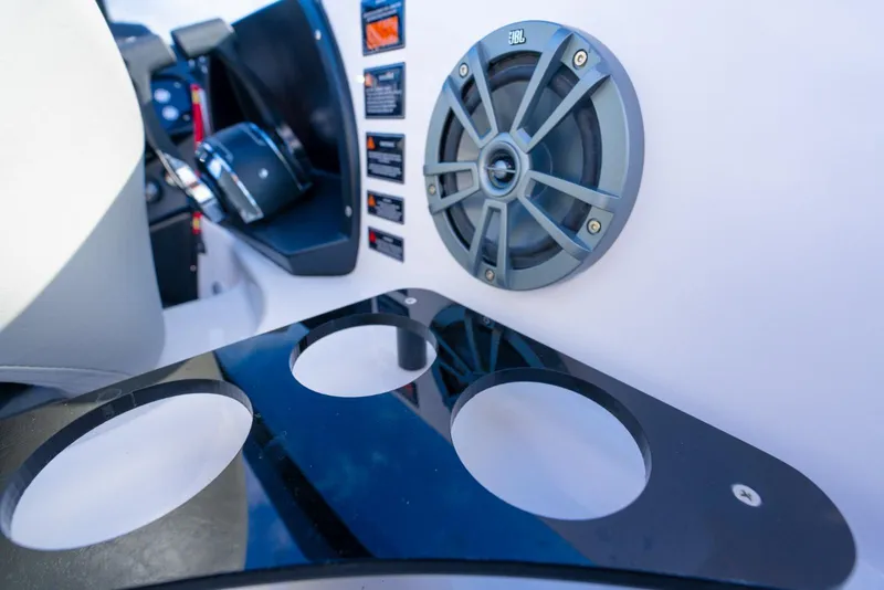 Slide: The Image of Control panel of Hanover 305 (2027) with speaker and cup holders. - 14