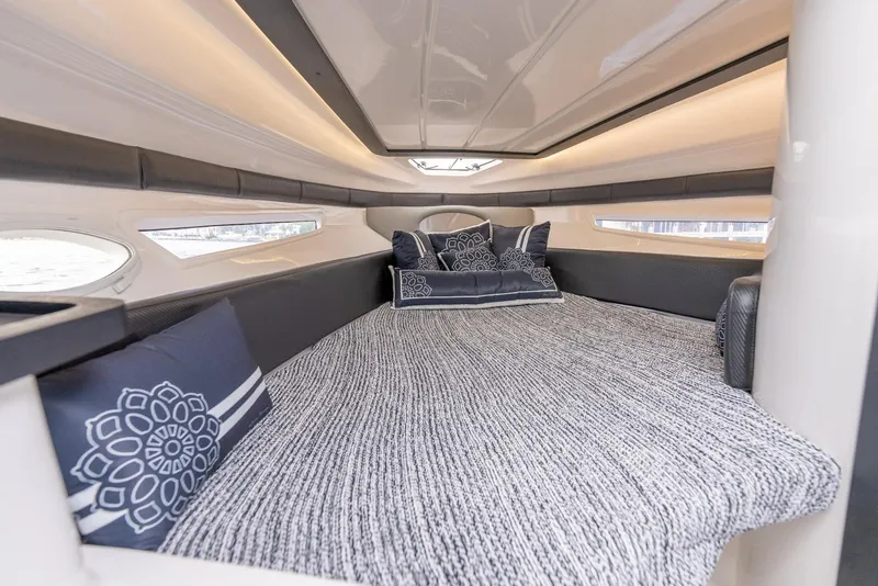 Slide: The Image of Luxurious interior cabin of 2027 Hanover 305 yacht with elegant bedding and cushions. - 3