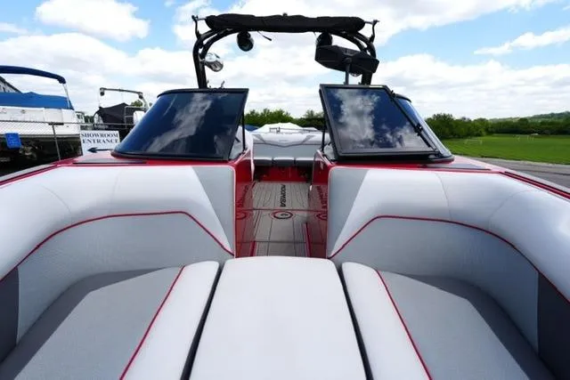 Slide: The Image of 2015 Moomba Mojo boat interior with sleek seating and modern design. - 11