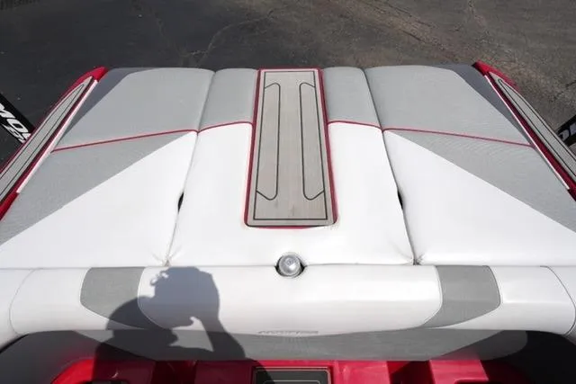 Slide: The Image of 2015 Moomba Mojo boat seat with red and gray accents, showcasing sleek design. - 17