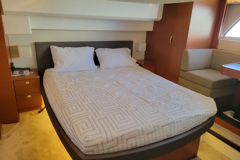 Slide: The Image of Luxurious bedroom interior of 2017 Prestige 500 yacht with modern furnishings and cozy bedding. - 36