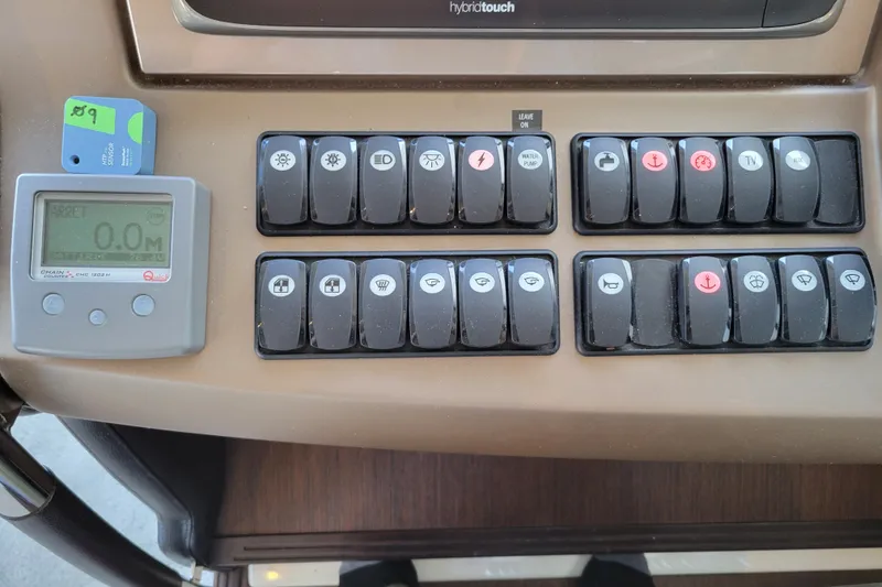 Slide: The Image of Control panel of a 2017 Prestige 500 yacht with various switches and a digital display. - 22