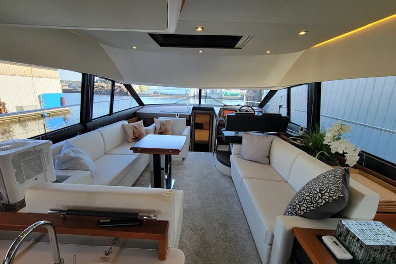 Slide: The Image of Luxurious interior of a 2017 Prestige 500 yacht with elegant seating and modern decor. - 12