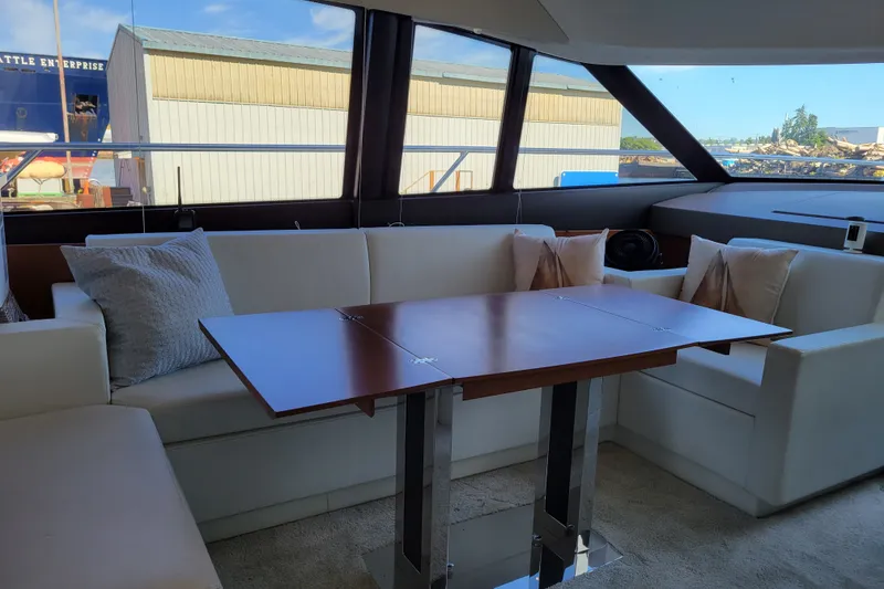 Slide: The Image of Luxurious interior of a 2017 Prestige 500 yacht with elegant seating and wooden table. - 14