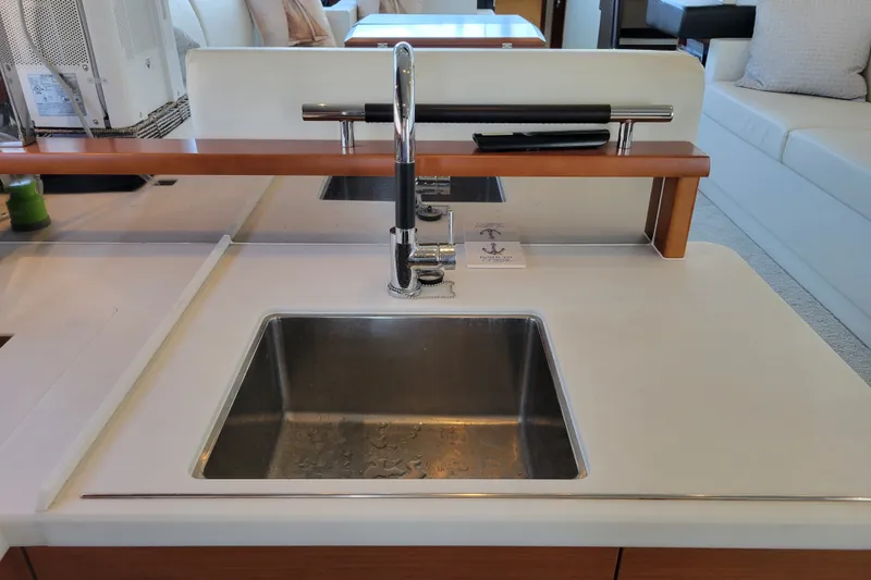 Slide: The Image of Modern kitchen sink on a 2017 Prestige 500 yacht, featuring sleek design and chrome faucet. - 43