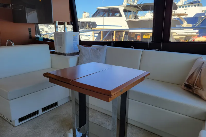 Slide: The Image of Luxurious interior of a 2017 Prestige 500 yacht with elegant seating and table. - 48