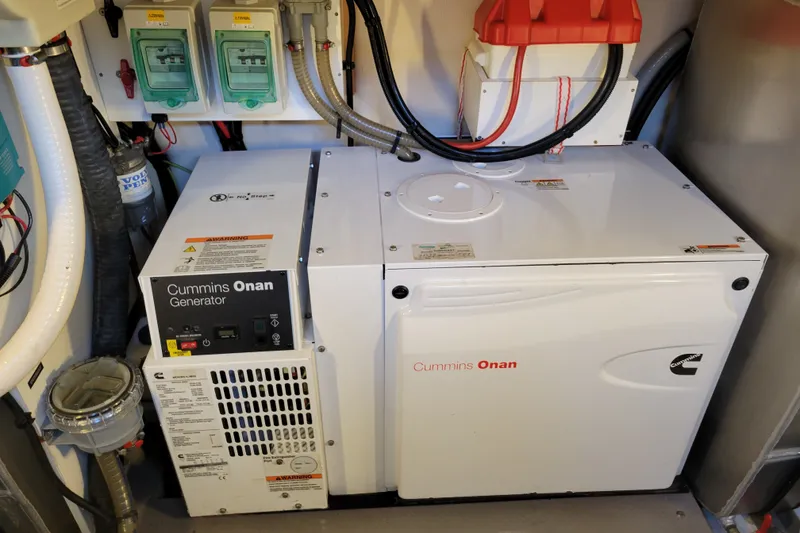 Slide: The Image of Cummins Onan generator in a 2017 Prestige 500 yacht engine room. - 52
