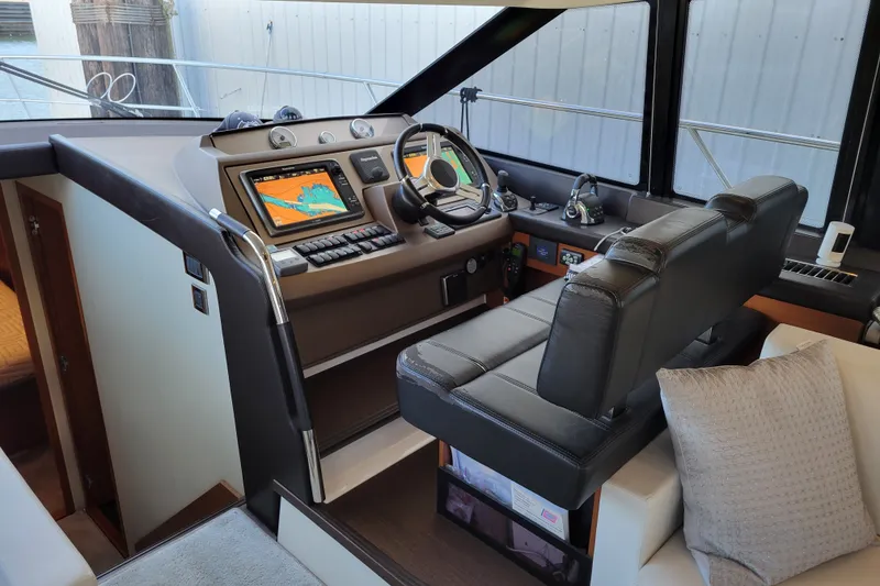 Slide: The Image of Luxurious helm station of a 2017 Prestige 500 yacht with modern navigation equipment. - 16